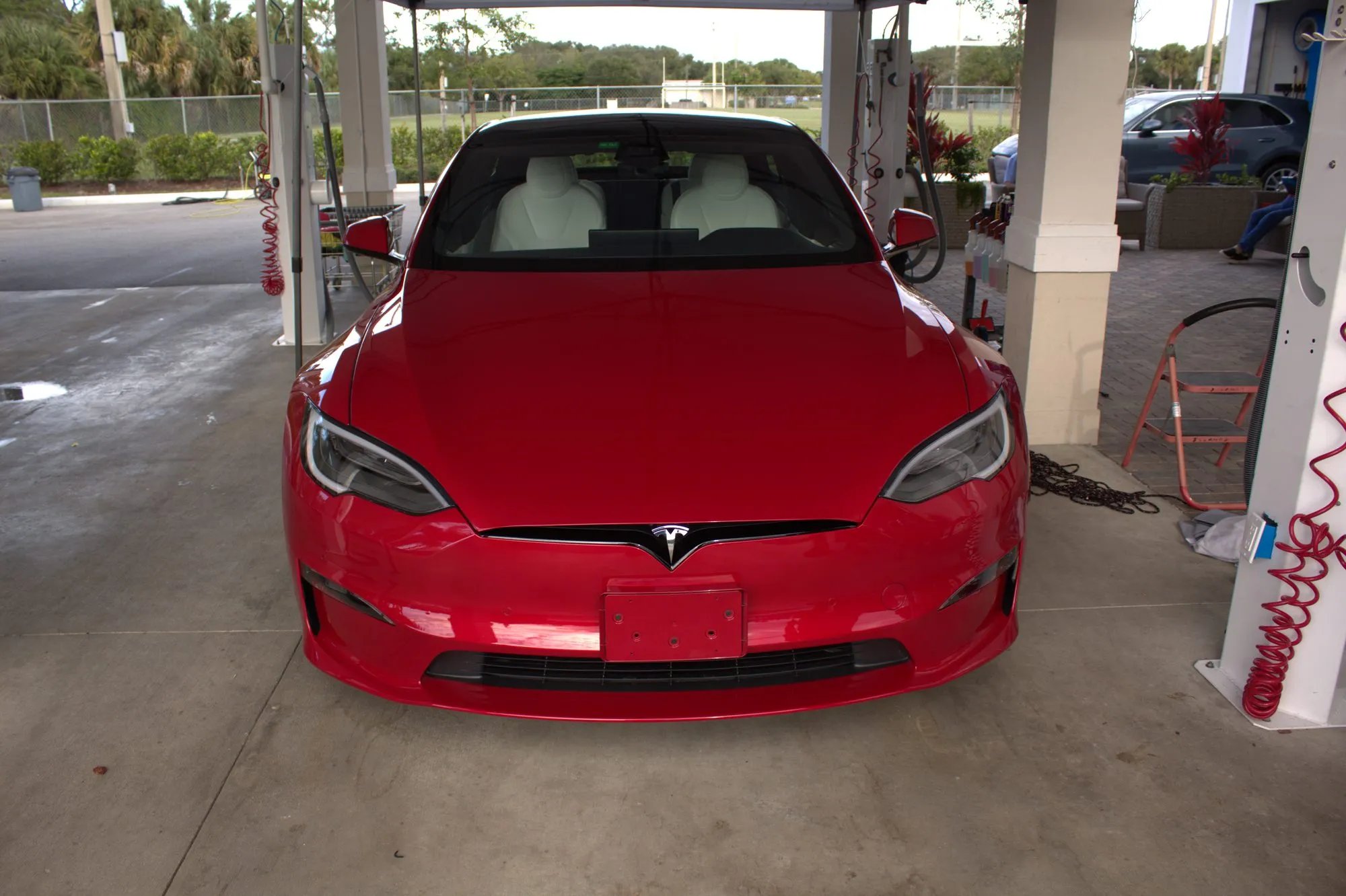 A freshly washed red Tesla Model S at Islands Auto Spa