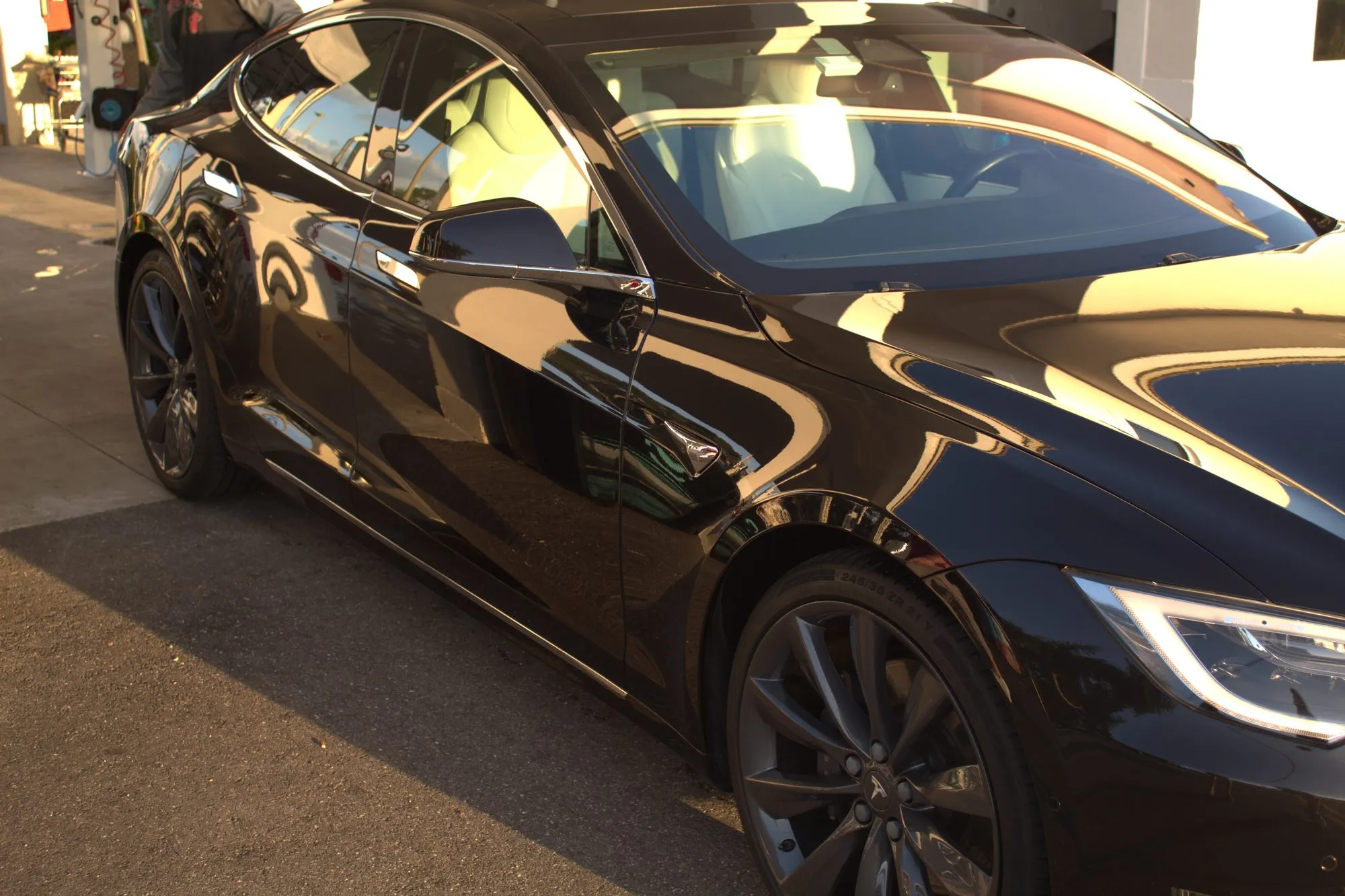 A glossy black Tesla Model S detailed to a mirror finish