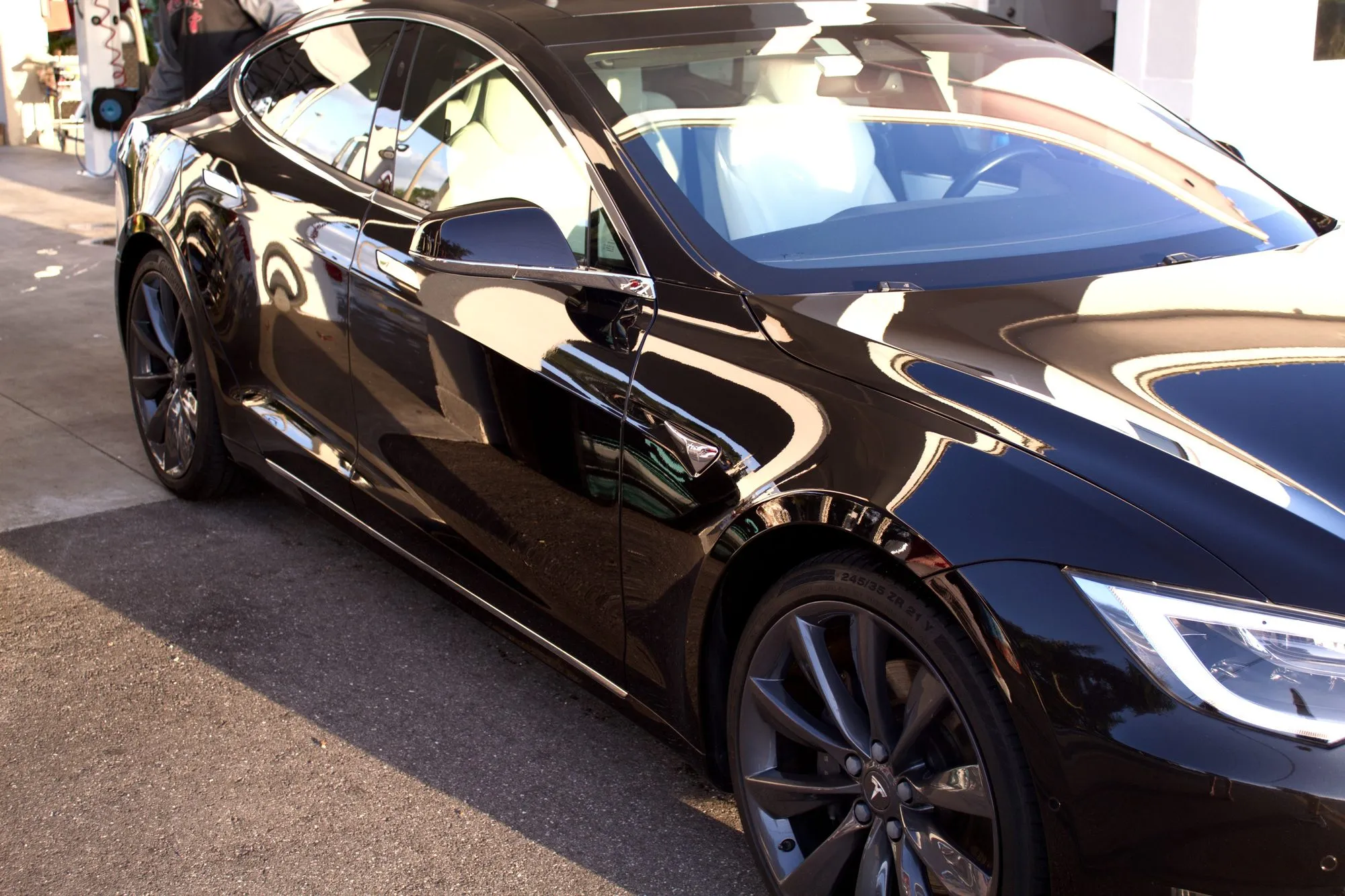 A black Porsche Panamera in the covered wash bay